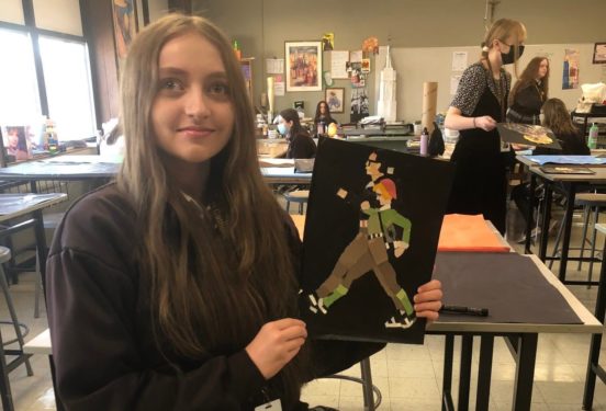 image of an art student with her work
