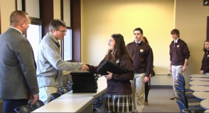 Principal, Luke Wilde looks on as Bethlehem High School students receive their new laptops on March 8, 2023 from Tom Vresics, Director of Advancement.