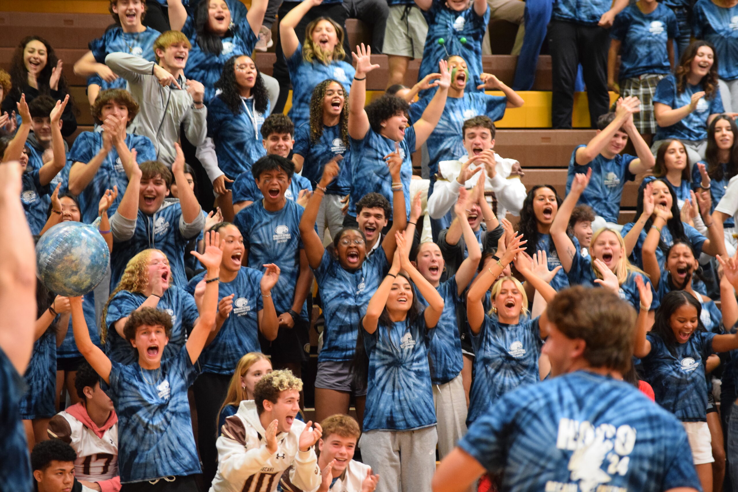 Students Cheering in blue tie dye shirts